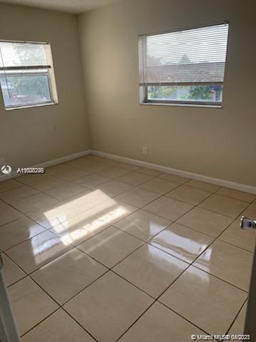 401 Southwest 13th Place, Unit 720 Deerfield Beach, FL 33441 - Photo 2 of 20 a view of a room with an empty space and a window