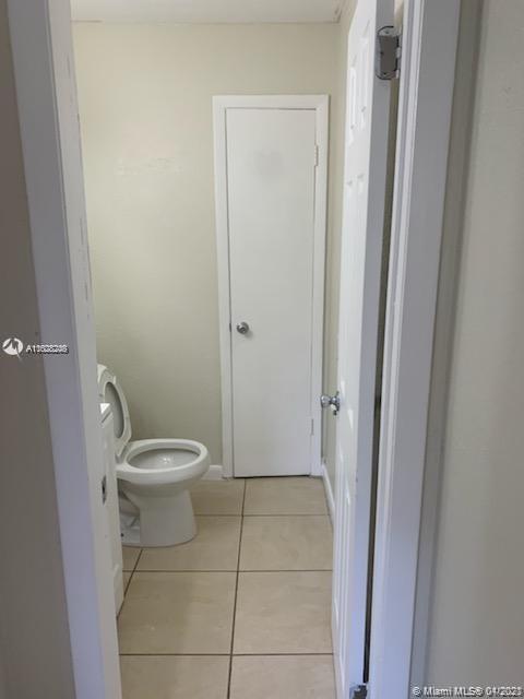 401 Southwest 13th Place, Unit 720 Deerfield Beach, FL 33441 - Photo 11 of 20 a bathroom with a toilet