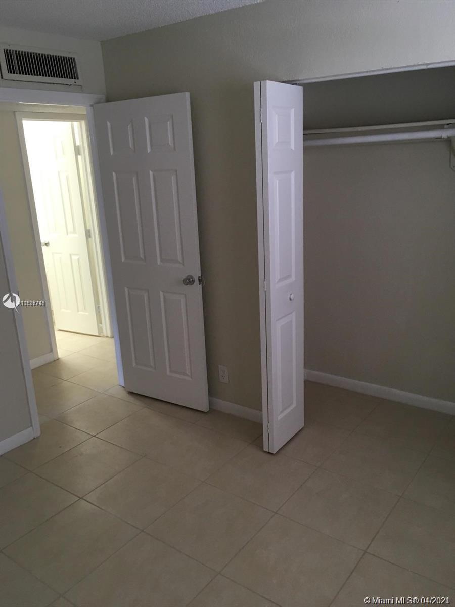 401 Southwest 13th Place, Unit 720 Deerfield Beach, FL 33441 - Photo 14 of 20 an empty room with windows