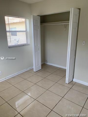 401 Southwest 13th Place, Unit 720 Deerfield Beach, FL 33441 - Photo 16 of 20 a view of an empty room and a window