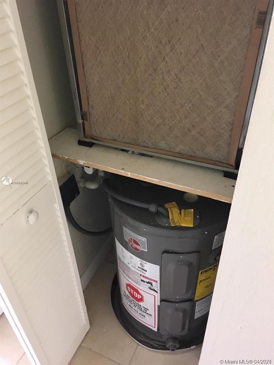 401 Southwest 13th Place, Unit 720 Deerfield Beach, FL 33441 - Photo 18 of 20 a utility room with dryer and washer
