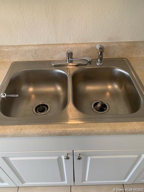 401 Southwest 13th Place, Unit 720 Deerfield Beach, FL 33441 - Photo 20 of 20 a close view of sink