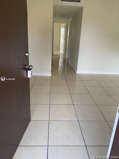 401 Southwest 13th Place, Unit 720 Deerfield Beach, FL 33441 - Photo 3 of 20 a view of a utility room and empty room