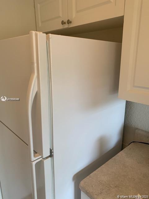 401 Southwest 13th Place, Unit 720 Deerfield Beach, FL 33441 - Photo 4 of 20 a close view of cabinet