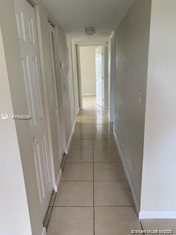 401 Southwest 13th Place, Unit 720 Deerfield Beach, FL 33441 - Photo 5 of 20 a view of a hallway