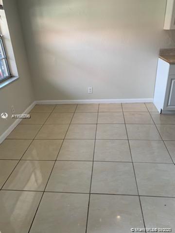 401 Southwest 13th Place, Unit 720 Deerfield Beach, FL 33441 - Photo 7 of 20 a view of a room with white tiles
