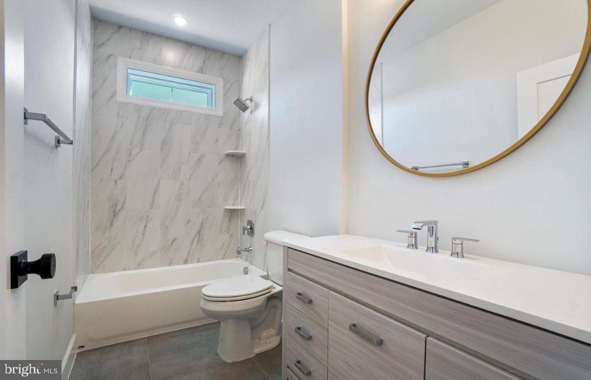 5 5 Forks Road New Freedom, PA 17349 - Photo 19 of 30 a bathroom with a sink a toilet and a mirror