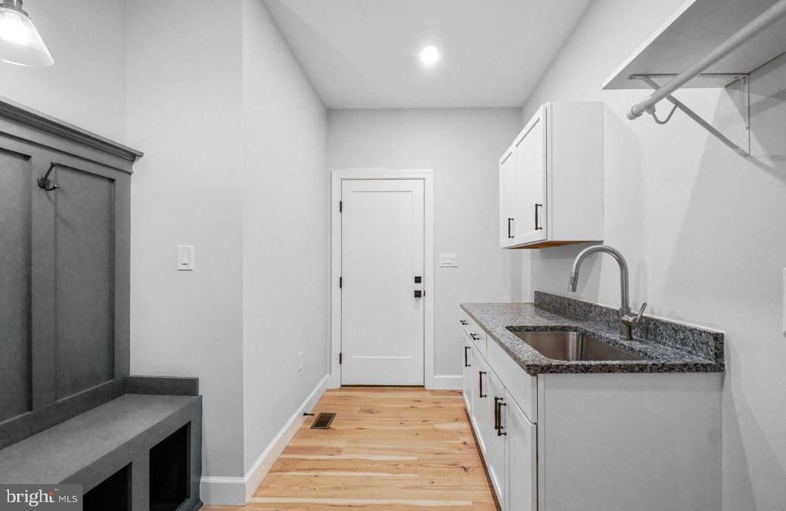 5 5 Forks Road New Freedom, PA 17349 - Photo 23 of 30 a kitchen with granite countertop a sink and cabinets