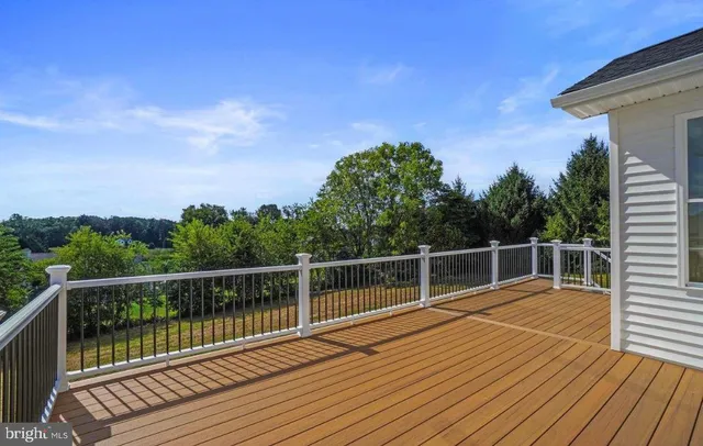 a view of a balcony with wooden floor