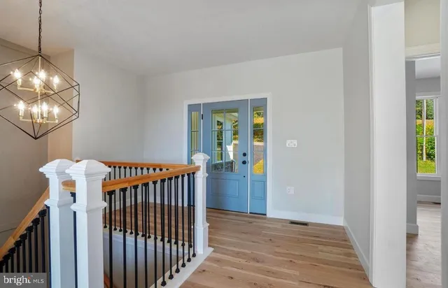 a view of entryway with wooden floor