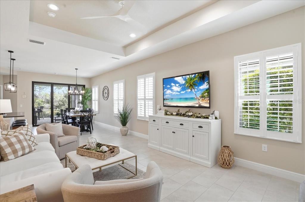 3511 Azurite Way Bradenton, FL 34211 - Photo 11 of 64 a living room with furniture and a flat screen tv