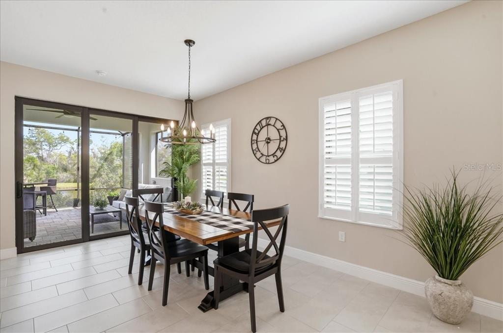 3511 Azurite Way Bradenton, FL 34211 - Photo 13 of 64 a view of a dining room with furniture window and outside view