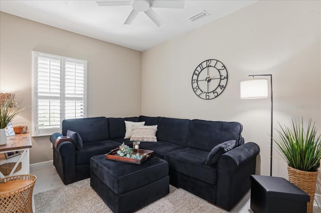 3511 Azurite Way Bradenton, FL 34211 - Photo 23 of 64 a living room with furniture and a large window