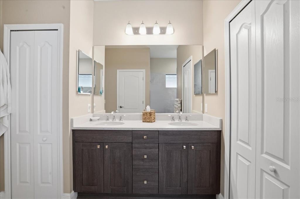 3511 Azurite Way Bradenton, FL 34211 - Photo 28 of 64 a bathroom with double sink and a mirror