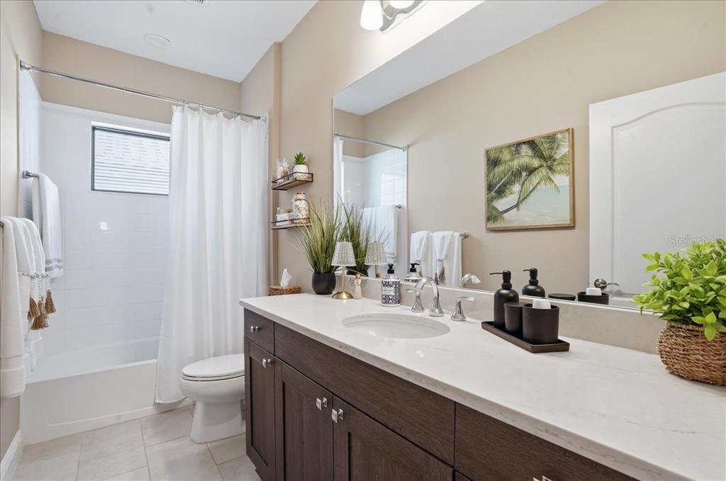 3511 Azurite Way Bradenton, FL 34211 - Photo 33 of 64 a bathroom with a sink a toilet and shower