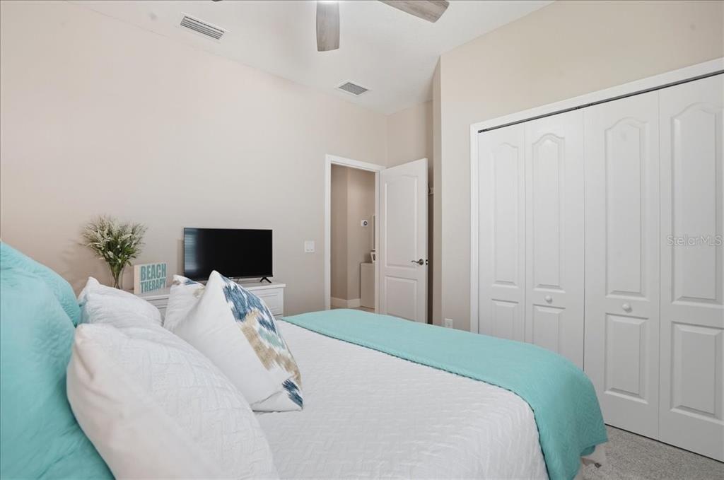 3511 Azurite Way Bradenton, FL 34211 - Photo 35 of 64 a bedroom with a bed and a television