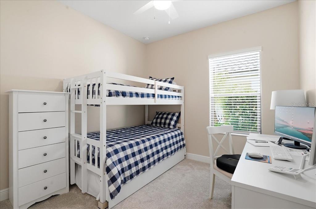 3511 Azurite Way Bradenton, FL 34211 - Photo 36 of 64 a bedroom with a bed and a window
