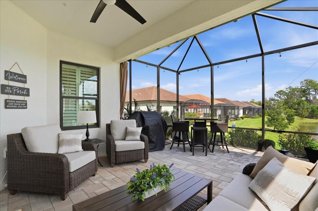3511 Azurite Way Bradenton, FL 34211 - Photo 43 of 64 a living room with furniture and a floor to ceiling window