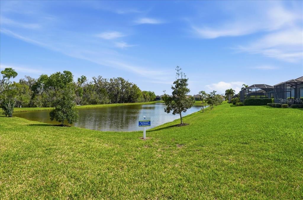 3511 Azurite Way Bradenton, FL 34211 - Photo 47 of 64 a view of a lake from a yard