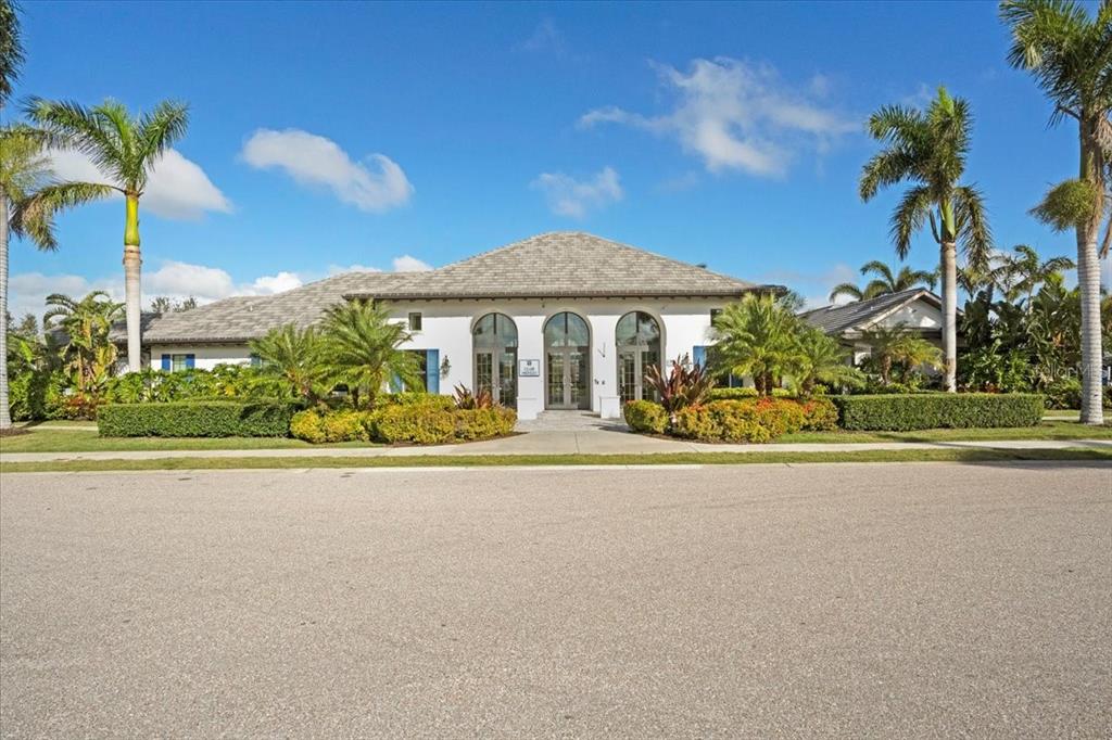 3511 Azurite Way Bradenton, FL 34211 - Photo 55 of 64 a front view of a house with a garden and a yard