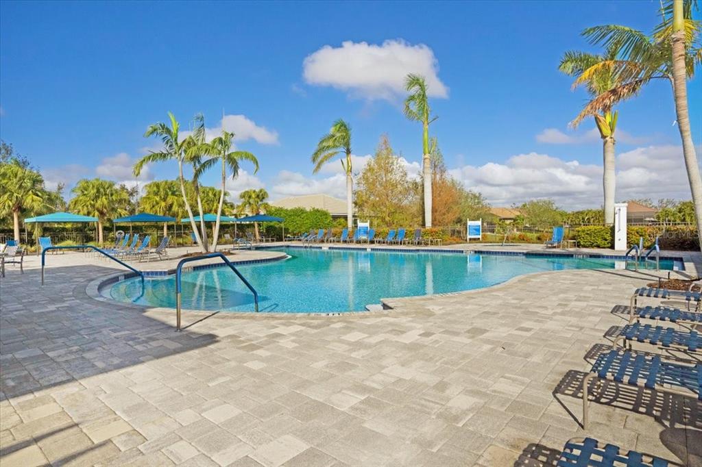 3511 Azurite Way Bradenton, FL 34211 - Photo 60 of 64 a view of a lake with a swimming pool and a terrace