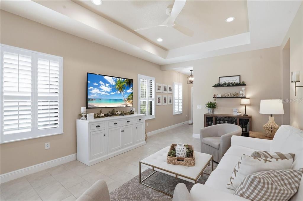 3511 Azurite Way Bradenton, FL 34211 - Photo 8 of 64 a living room with furniture and a flat screen tv