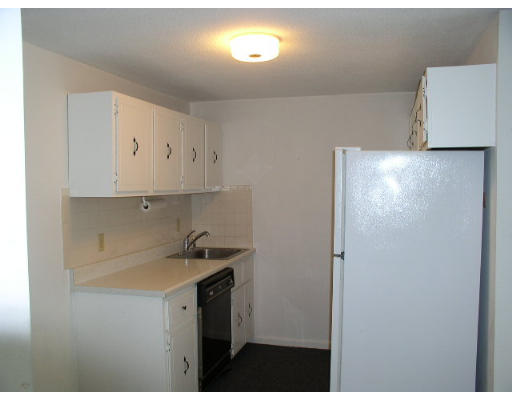 12 Leonard Road, Unit 12 Boxborough, MA 01719 - Photo 3 of 4 a kitchen with a sink and cabinets