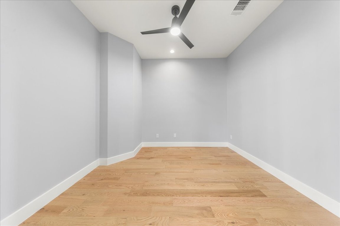 217 Gato Road Cedar Creek, TX 78612 - Photo 33 of 39 Empty room featuring light wood finished floors and ceiling fan