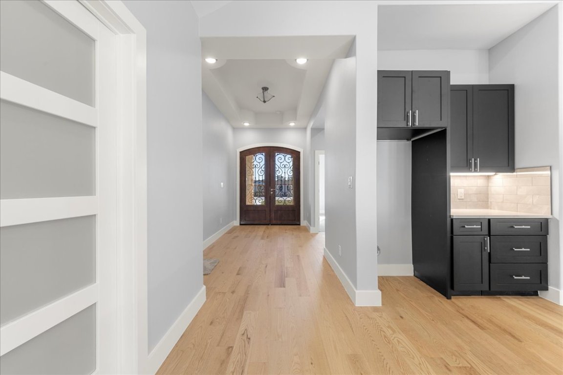 217 Gato Road Cedar Creek, TX 78612 - Photo 7 of 39 Foyer entrance featuring recessed lighting, light wood finished floors, french doors, and arched walkways