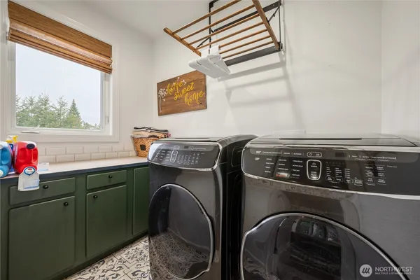 a utility room with dryer and washer