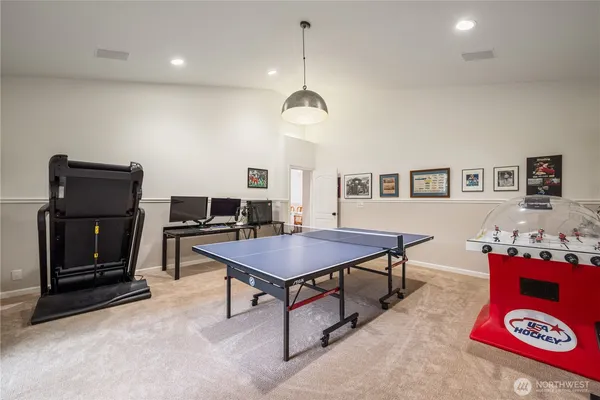 a living room with furniture a piano and a flat screen tv