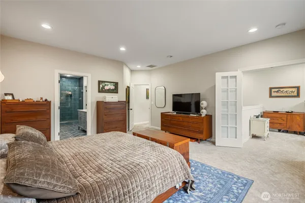 a bedroom with a bed and a couch