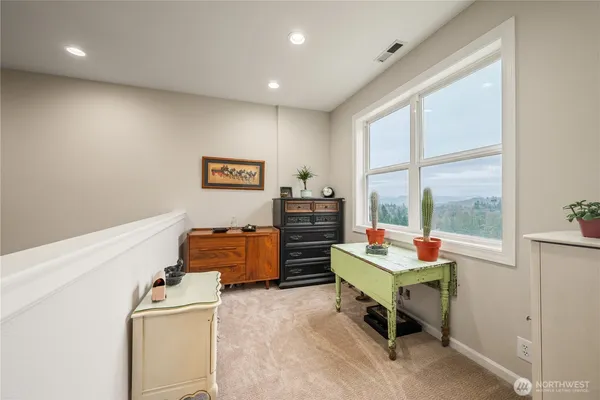 a bedroom with furniture and a window