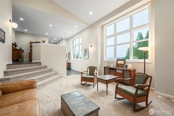 a living room with furniture and a large window