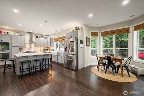 a view of a dining room with furniture window and wooden floor