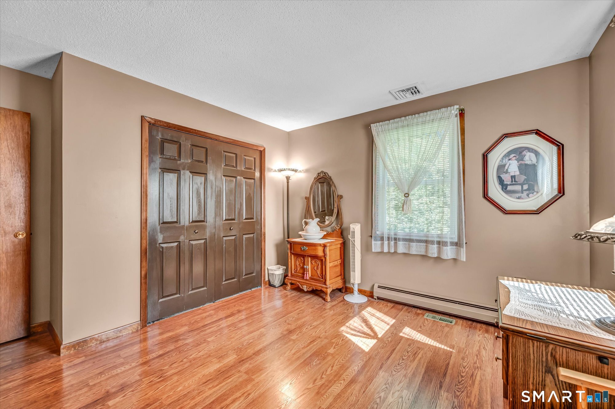 65 R Hanover Street Wallingford, CT 06492 - Photo 21 of 37 Second bedroom has laminate flooring.