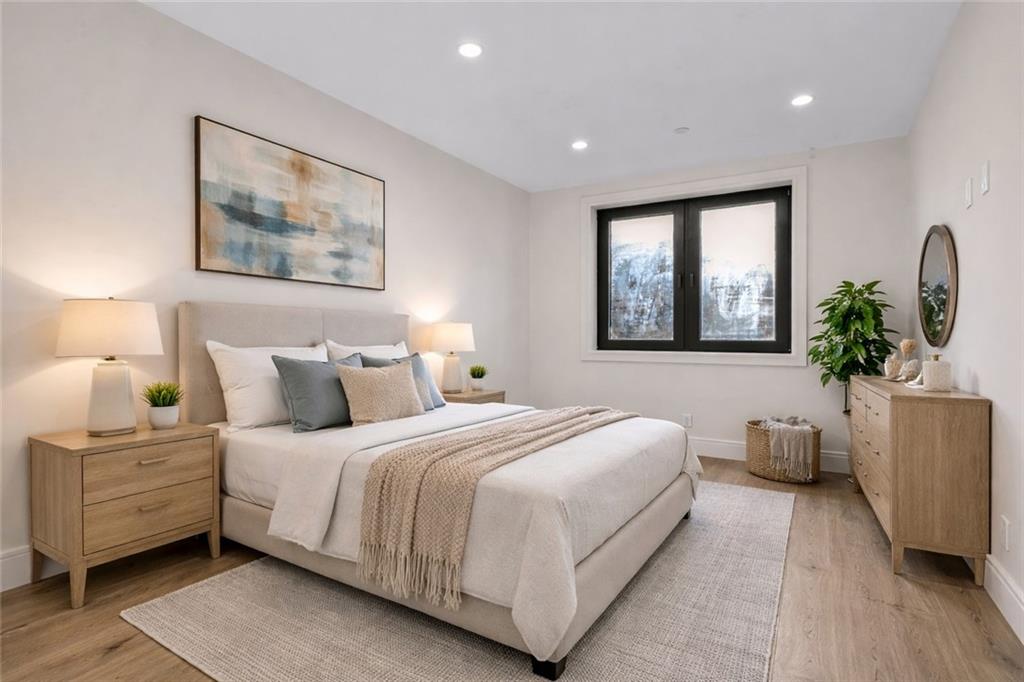 266 10th Street, Unit 2 Brooklyn, NY 11215 - Photo 9 of 17 a bedroom with bed and a potted plant