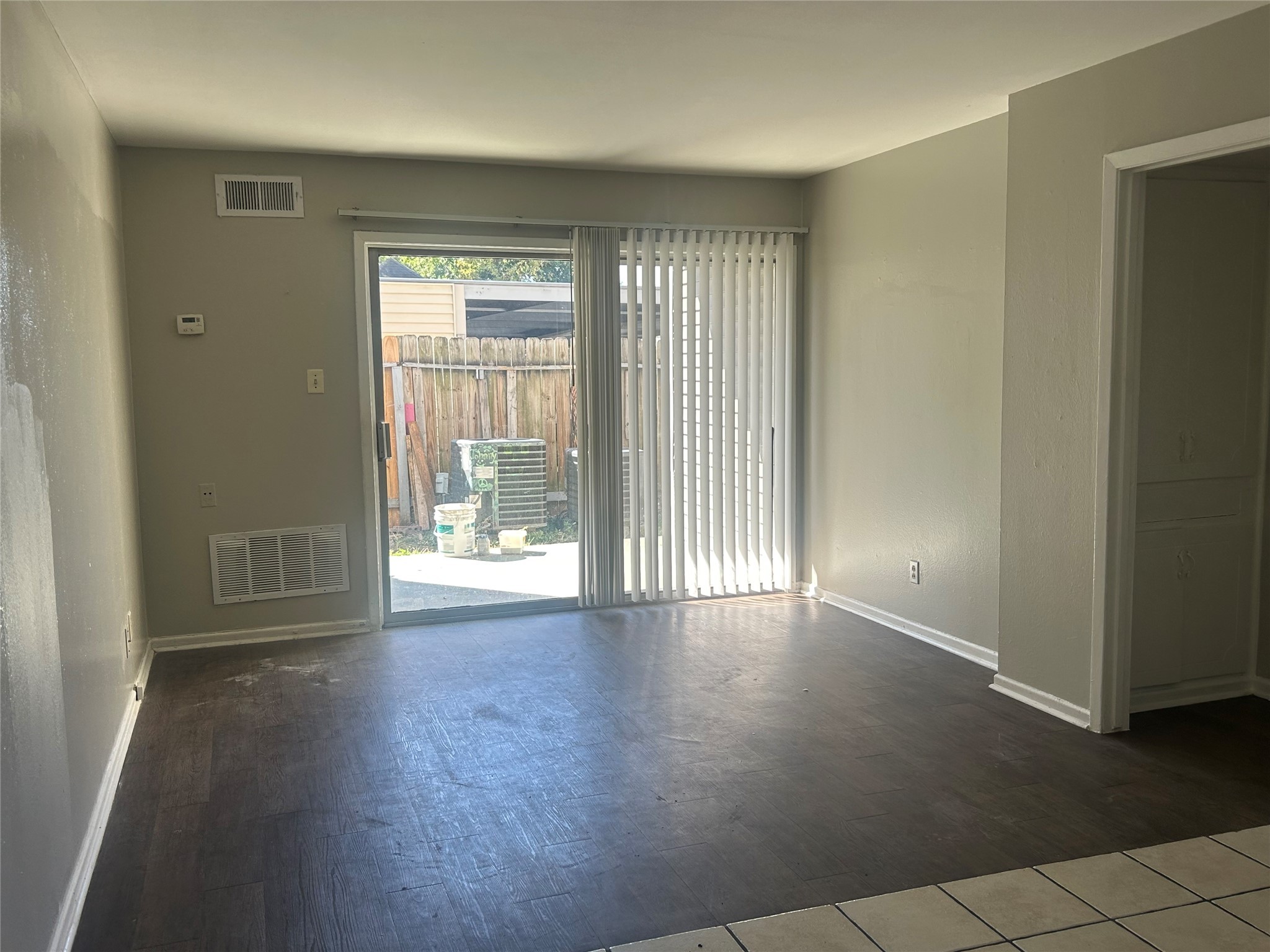 6702 Biggs Court, Unit 4 Houston, TX 77061 - Photo 4 of 6 an empty room with wooden floor and windows