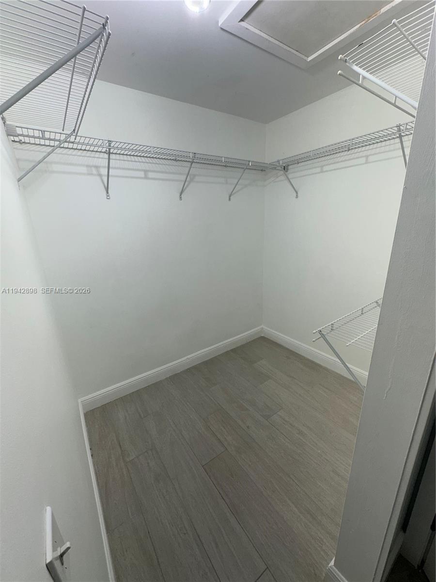 15250 Southwest 134th Place, Unit 112 Miami, FL 33177 - Photo 13 of 17 a view of an empty walk in closet