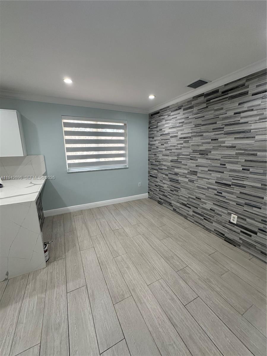 15250 Southwest 134th Place, Unit 112 Miami, FL 33177 - Photo 2 of 17 a view of livingroom with an empty space and a window