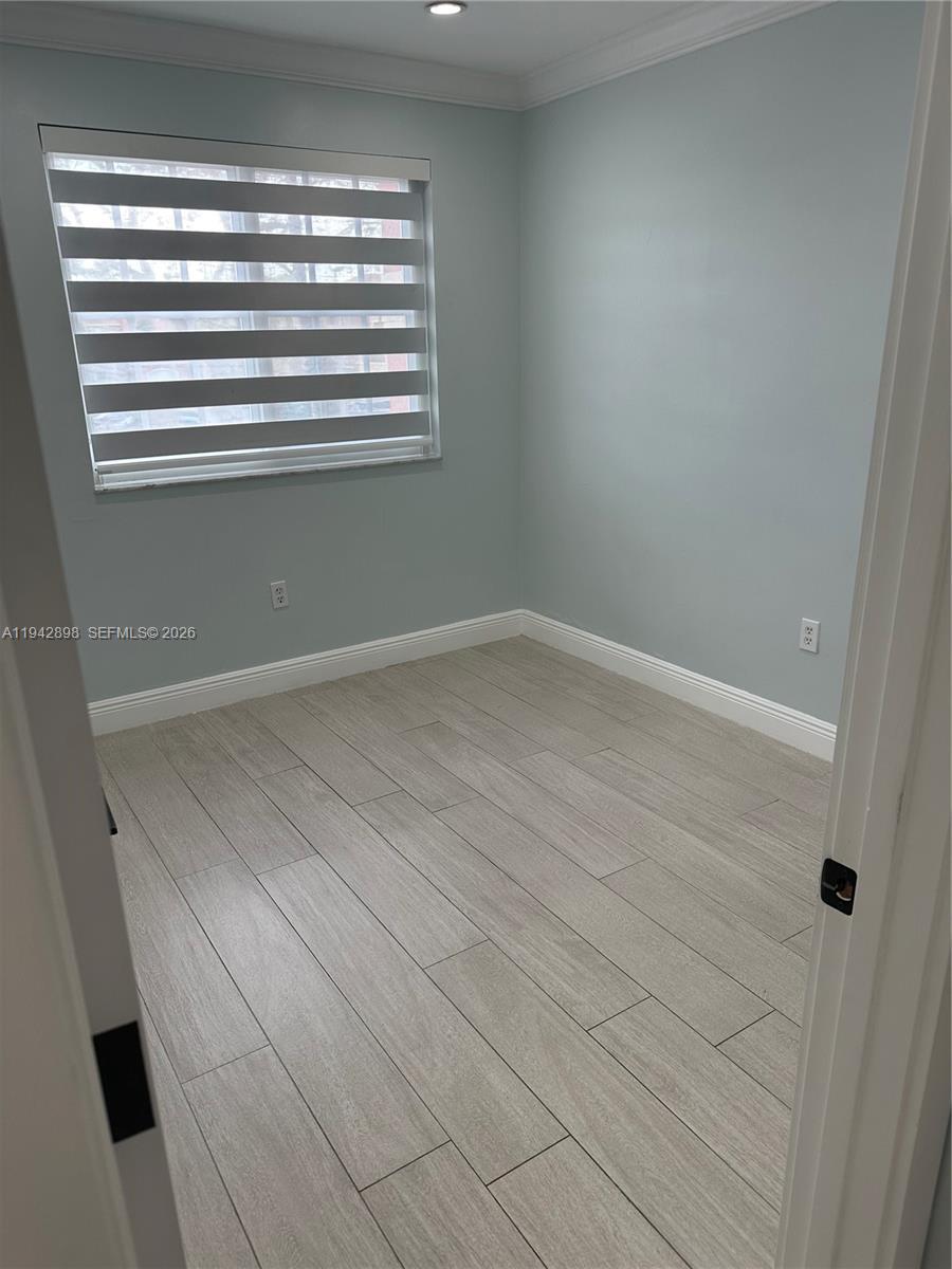 15250 Southwest 134th Place, Unit 112 Miami, FL 33177 - Photo 8 of 17 a view of a room that has a window in it