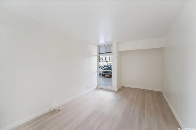 a view of wooden floor and chandelier in a room