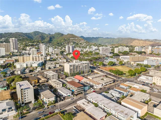 an aerial view of city and parking