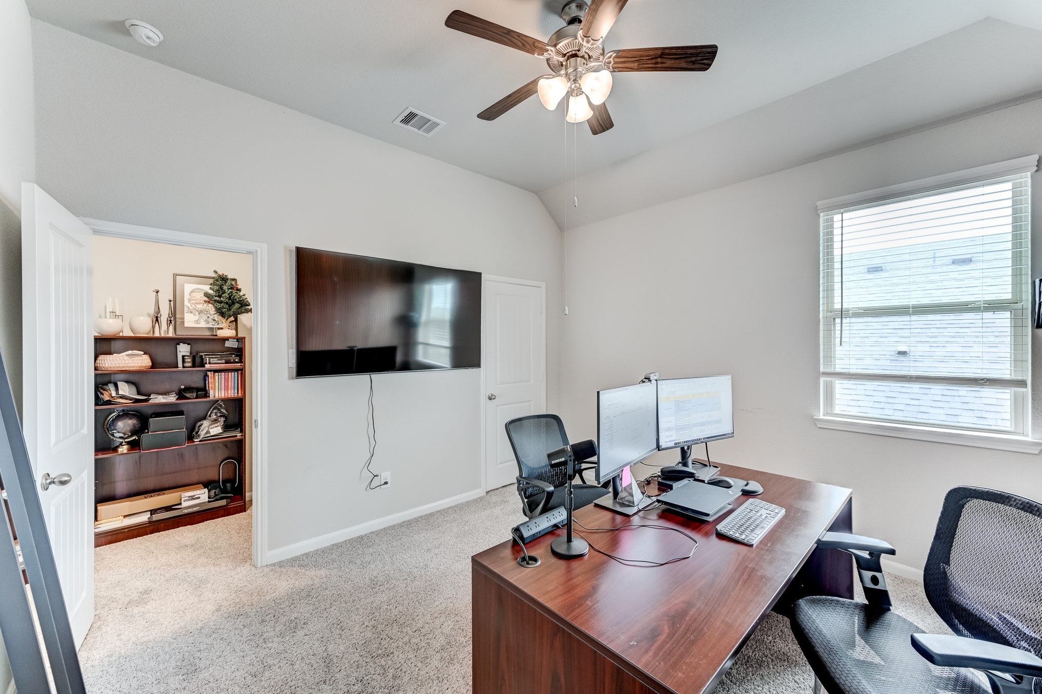 5806 Metaphor Way Rosenberg, TX 77469 - Photo 37 of 50 a view of a workspace with furniture and a window