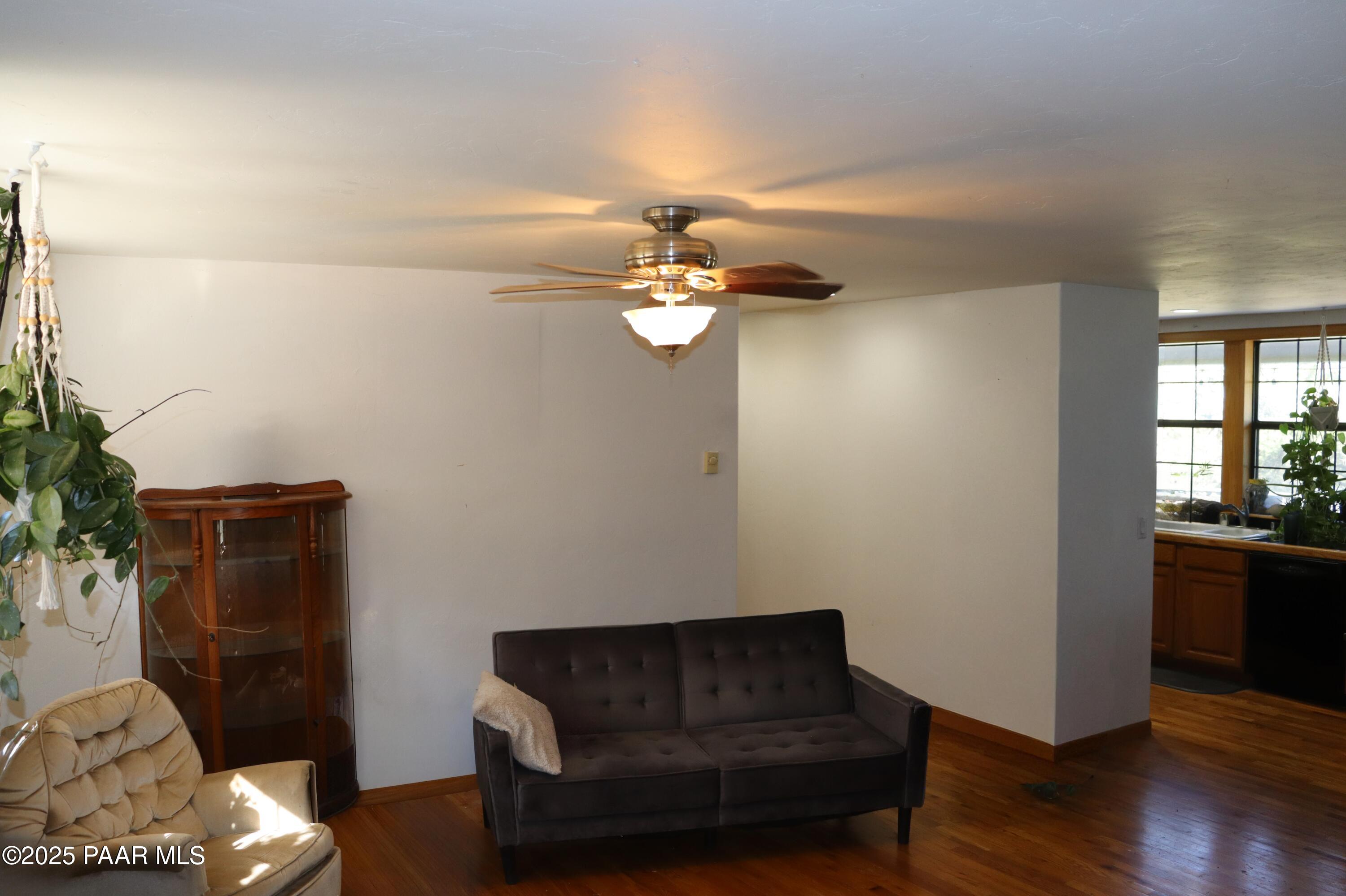 3085 North Diablo Road Chino Valley, AZ 86323 - Photo 17 of 24 a living room with furniture and a potted plant