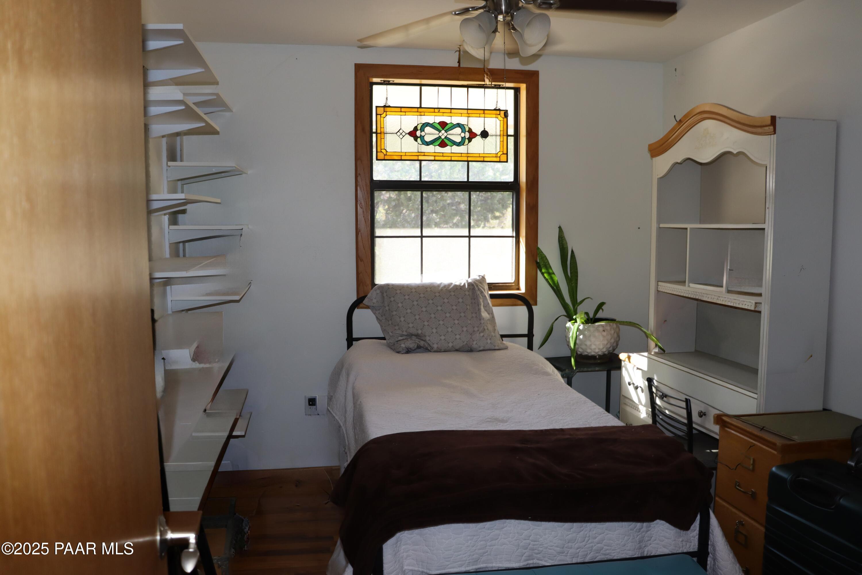 3085 North Diablo Road Chino Valley, AZ 86323 - Photo 20 of 24 a bedroom with a bed and a window