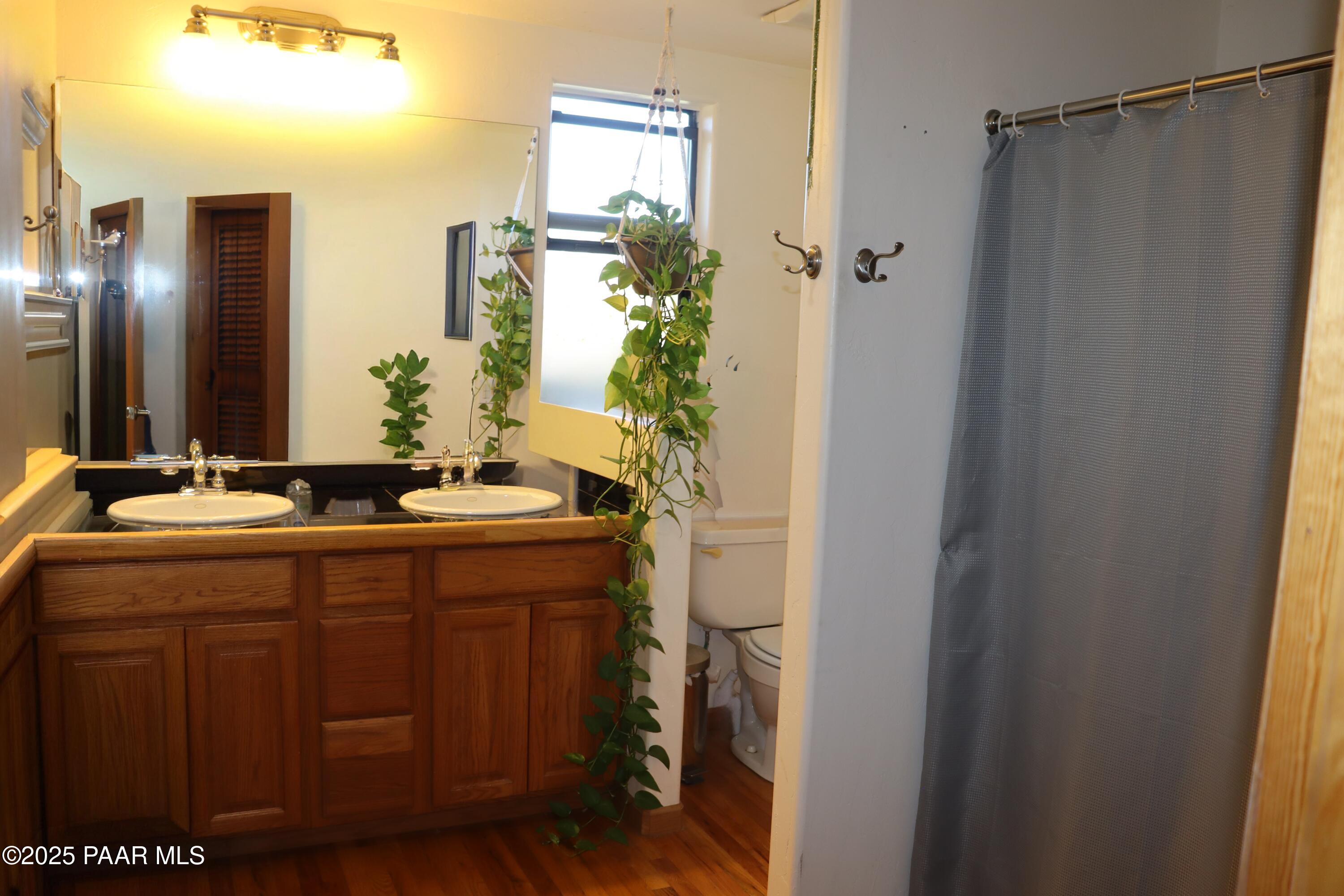 3085 North Diablo Road Chino Valley, AZ 86323 - Photo 23 of 24 a bathroom with a double vanity sink and mirror