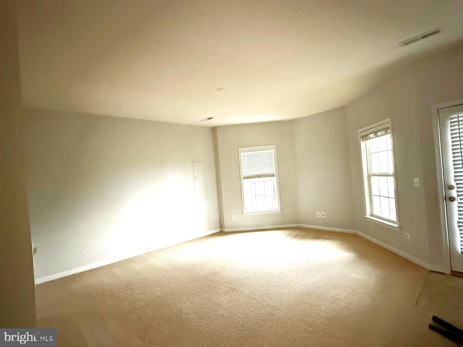 22573 Highcroft Terrace Brambleton, VA 20148 - Photo 12 of 13 a view of empty room with wooden floor and fan