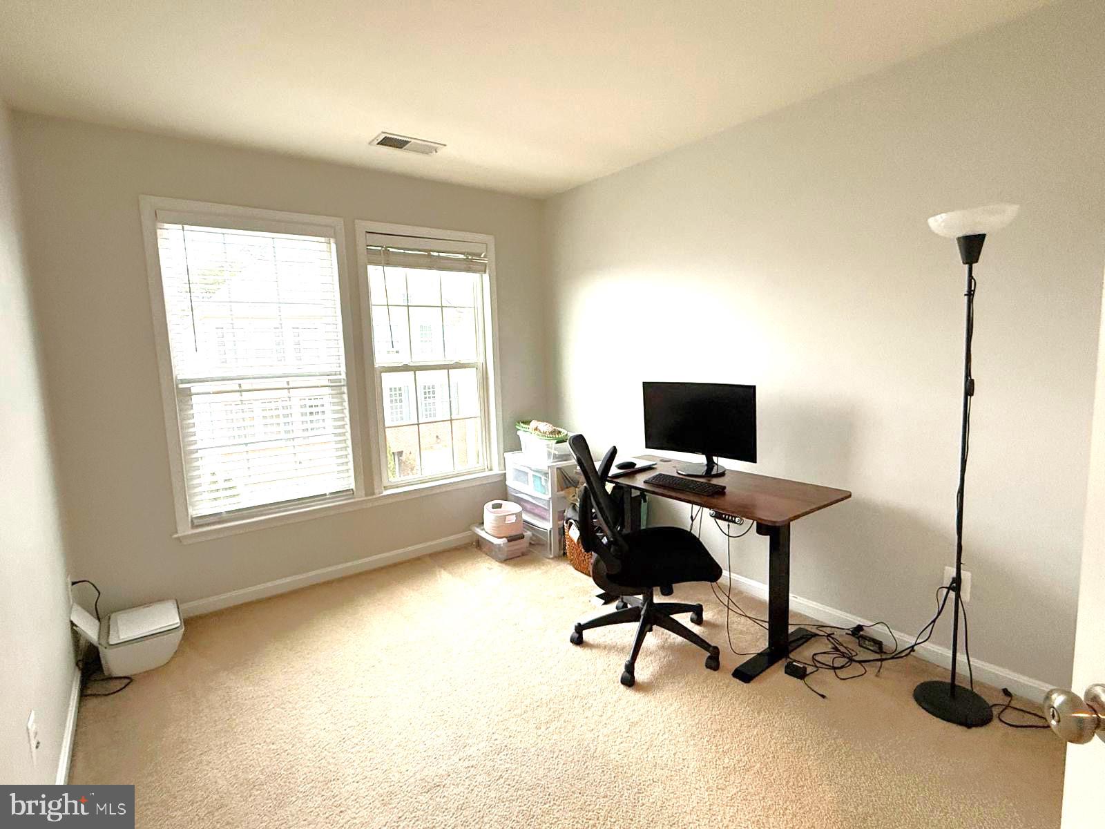 22573 Highcroft Terrace Brambleton, VA 20148 - Photo 7 of 13 a view of a workspace with furniture and a window