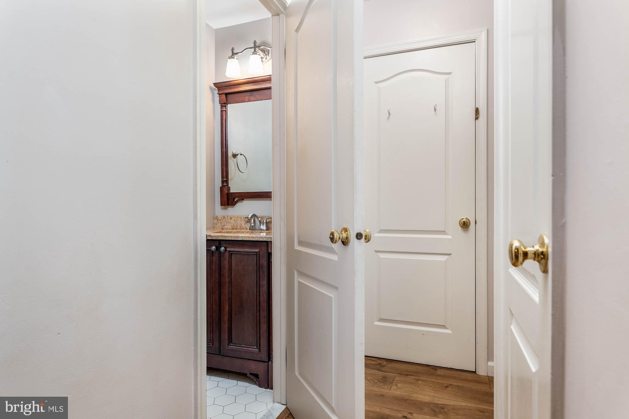 261 Valley Forge Lookout Place Wayne, PA 19087 - Photo 7 of 37 Powder room, storage & utility closet, & garage